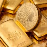 Goldbarren und Münzen; Foto: AdobeStock